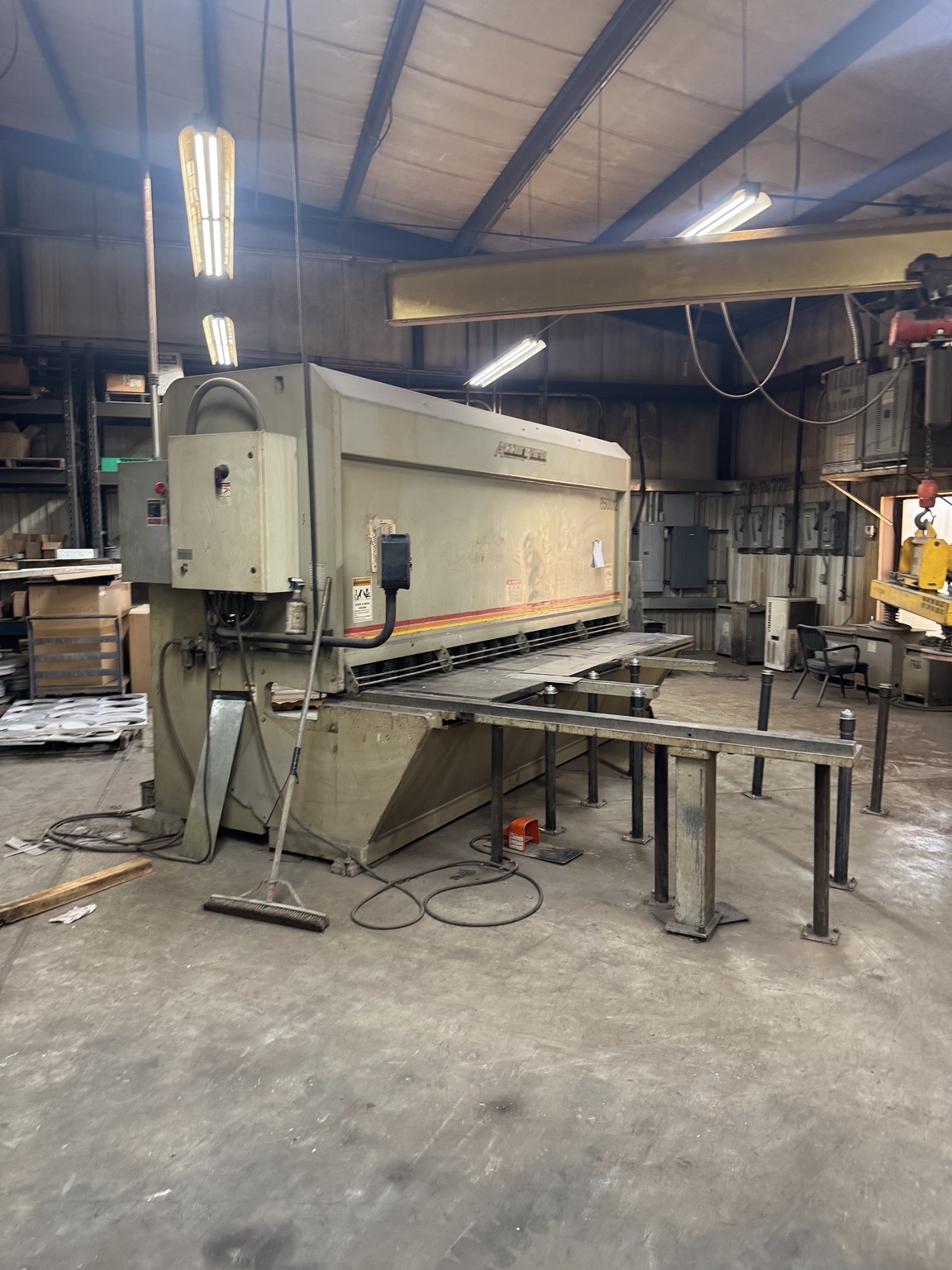 Industrial shear in manufacturing facility